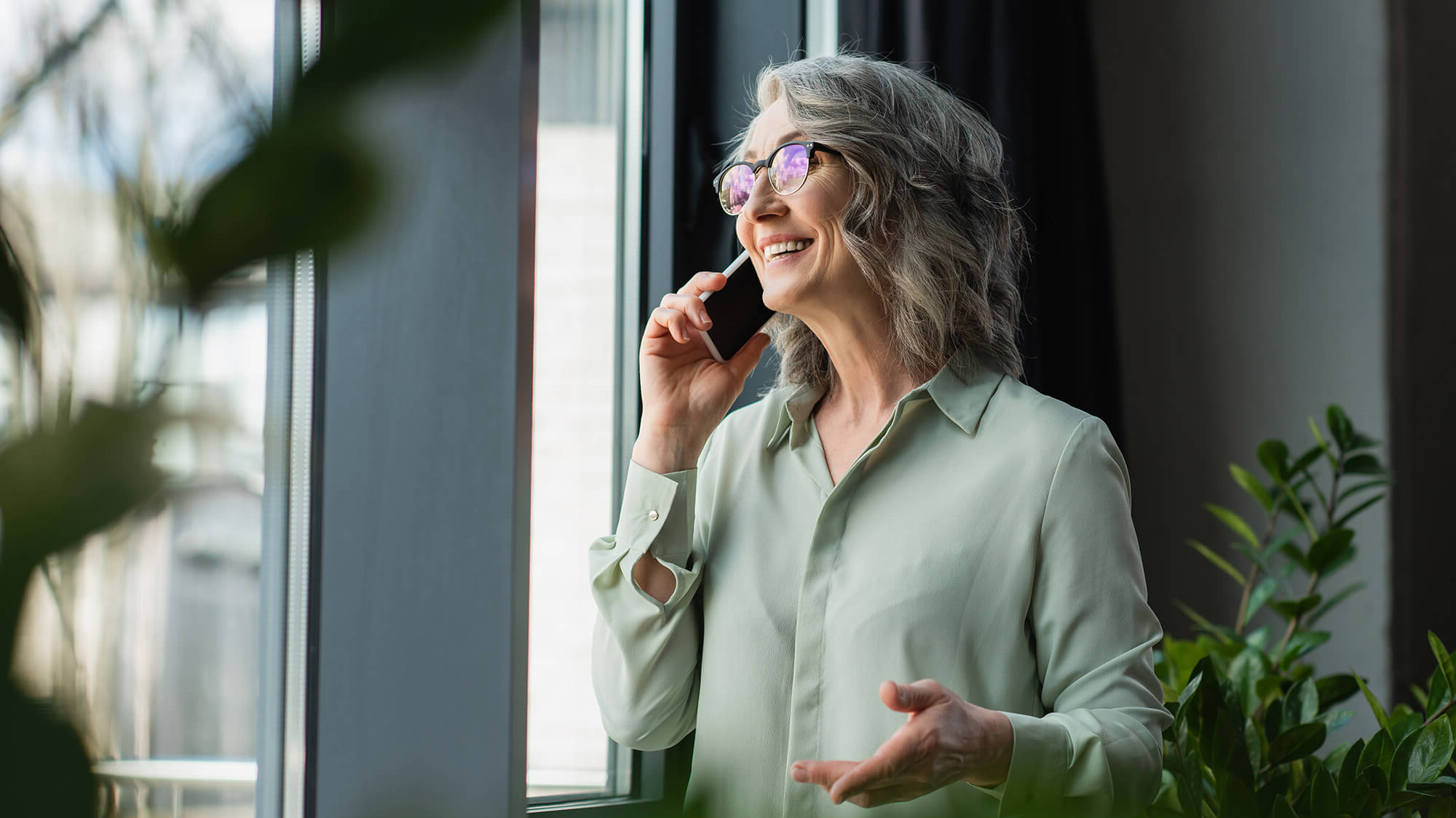 happy_mature_woman_talking_on_phone